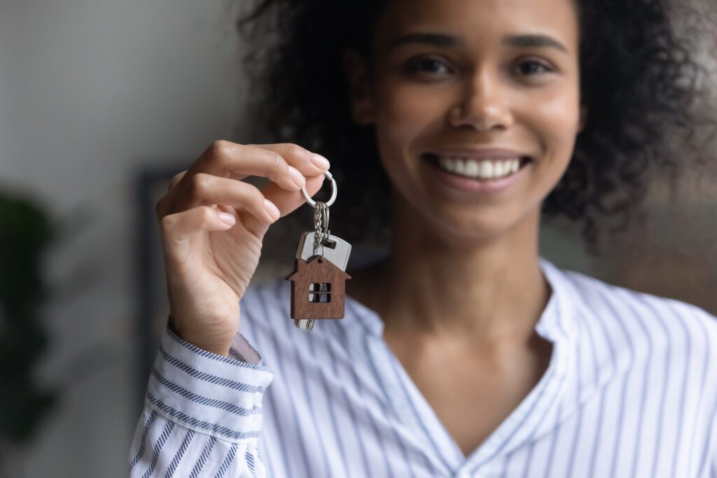 Focus,On,Keys,In,Female,Hands,,Smiling,Young,African,American