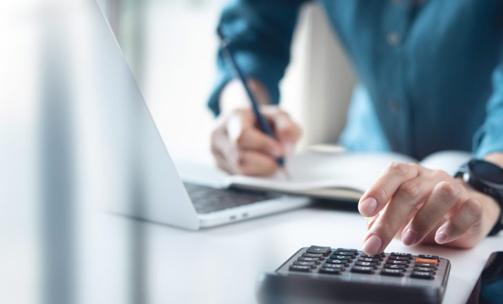 Doing,Finance,,Budgeting,And,Tax,Calculation.,Close,Up,Woman,Hand